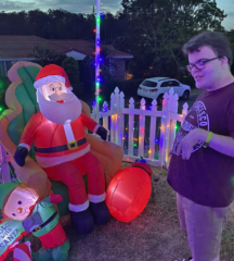 Mitchell looking at an inflatable Santa