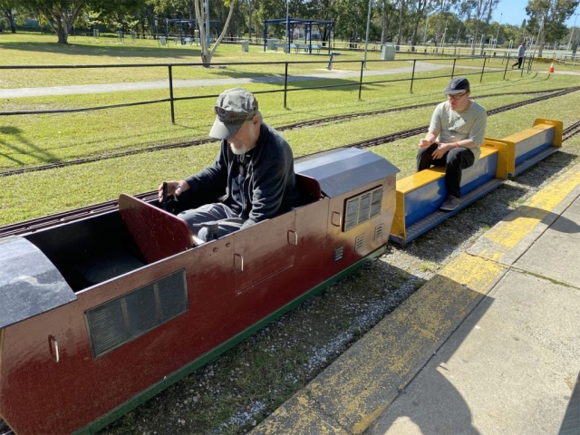 Mitchell riding on the miniature train